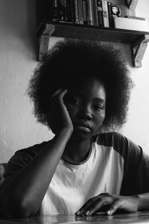 woman sitting in the dining room, black and white pograph