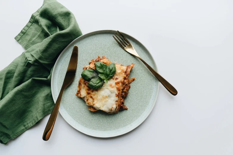 a piece of pizza on top of a plate