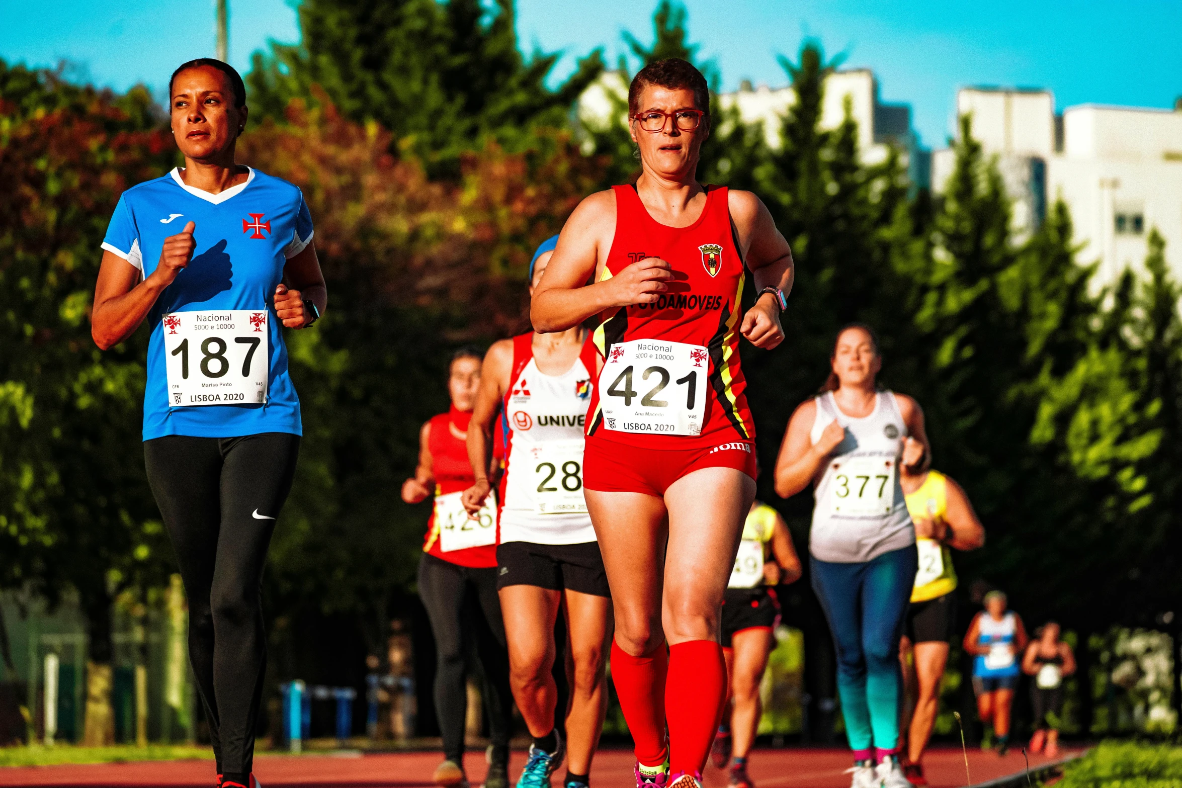 athletes compete in a city marathon in the daytime