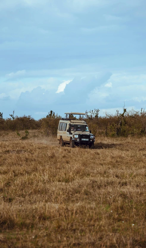 an old van that is sitting in a field