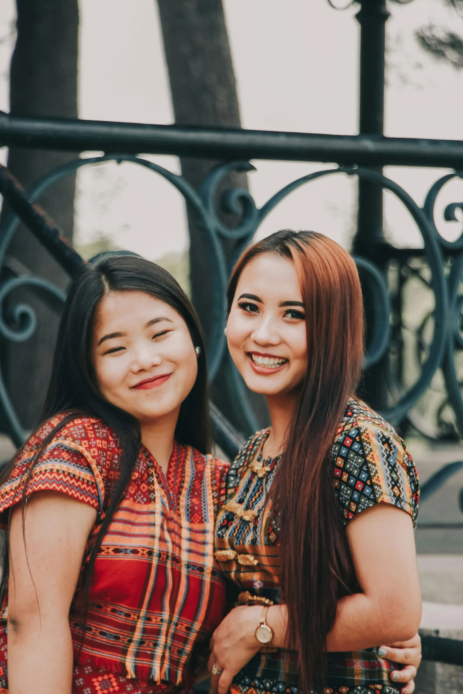 two beautiful young women are standing next to each other