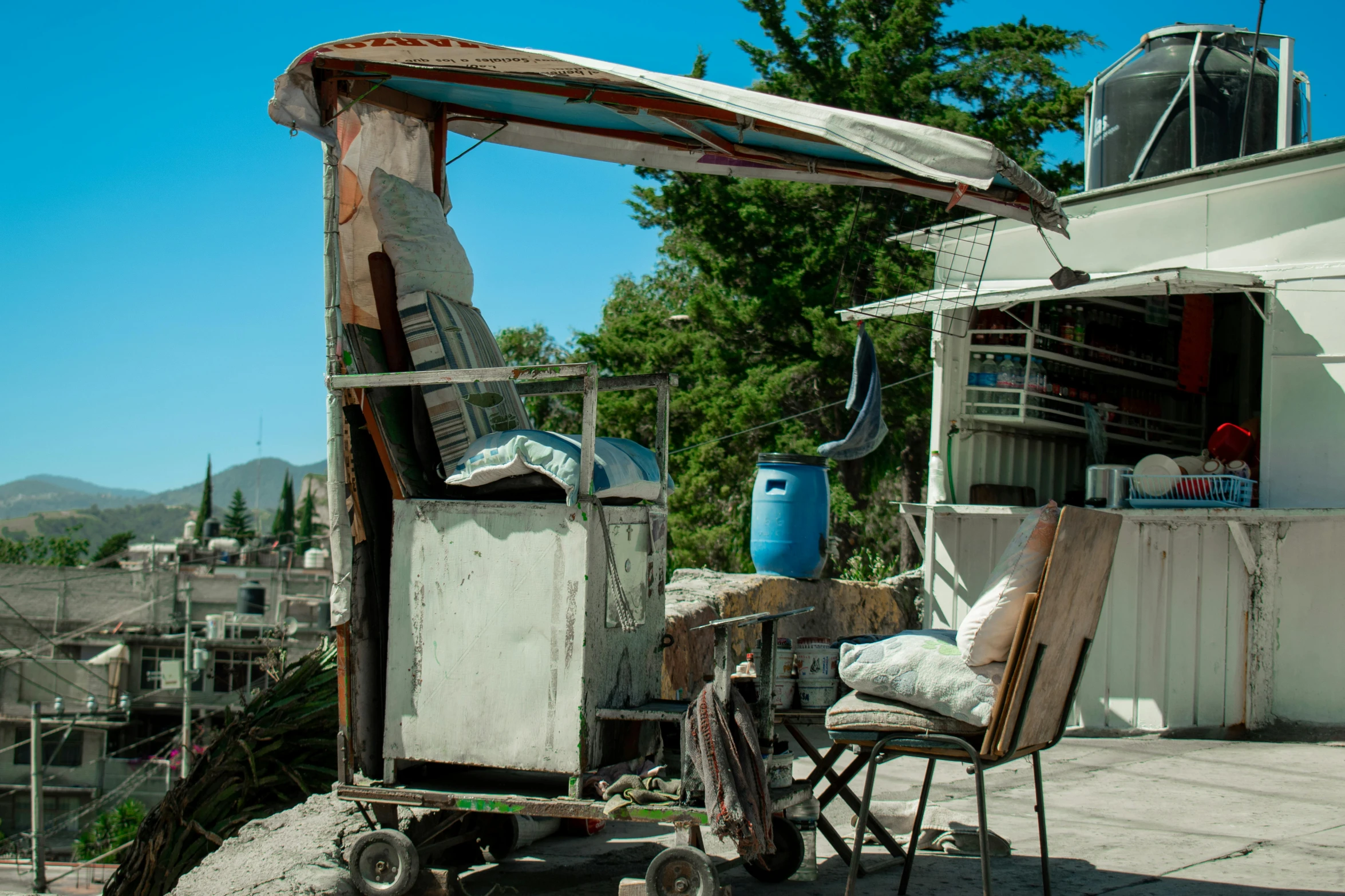 an old building with lots of furniture outside