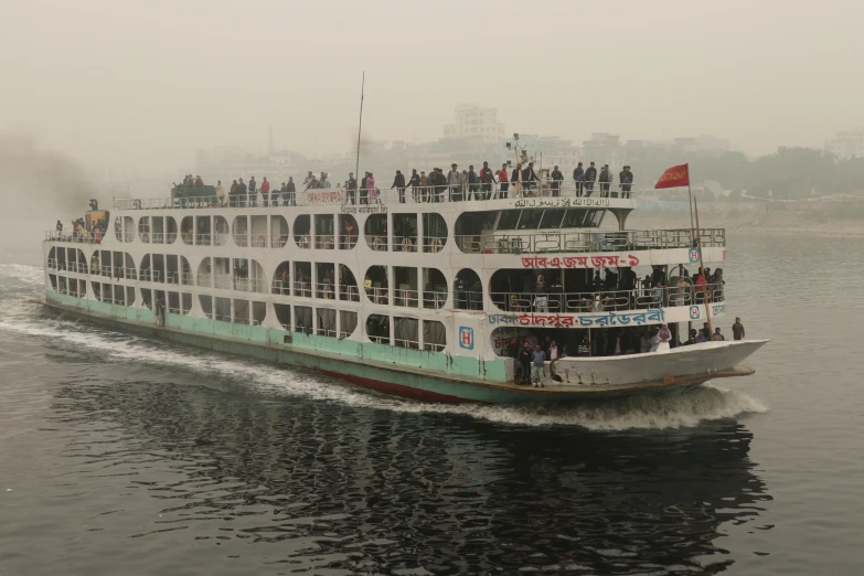 a blue and white passenger boat in the water