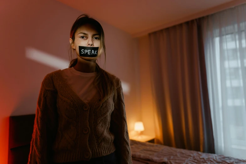 a woman is shown in a sweater with a taped head that says dream