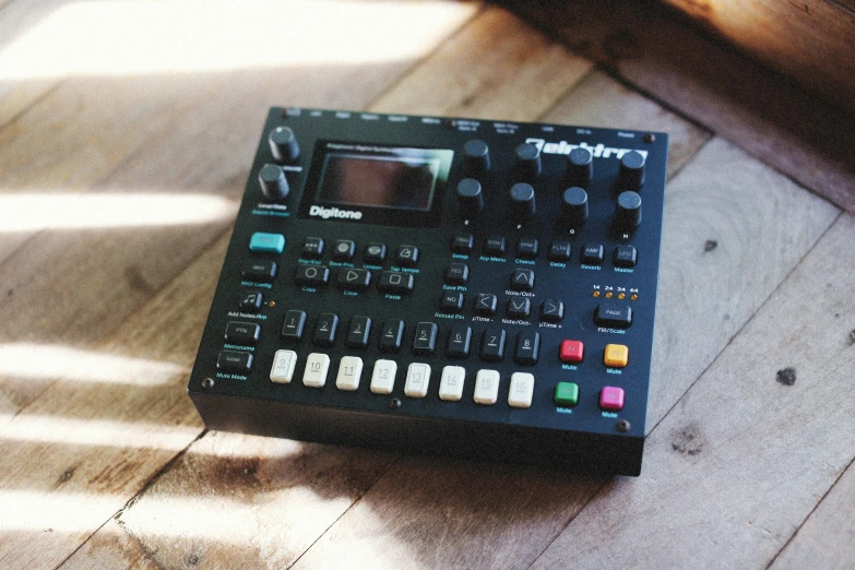 a remote control unit on the floor in an empty room