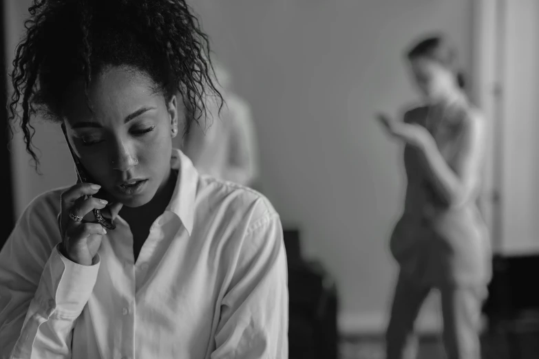 a woman with natural hair brushing her teeth