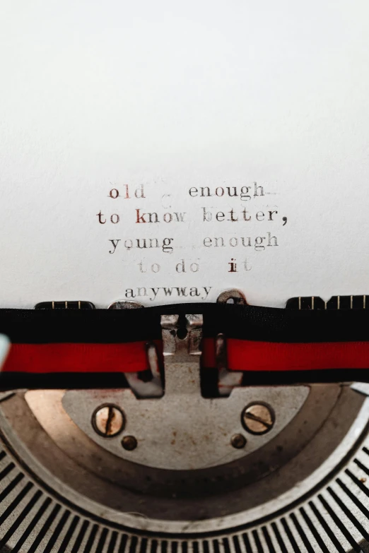 the words on an old typewriter can be seen