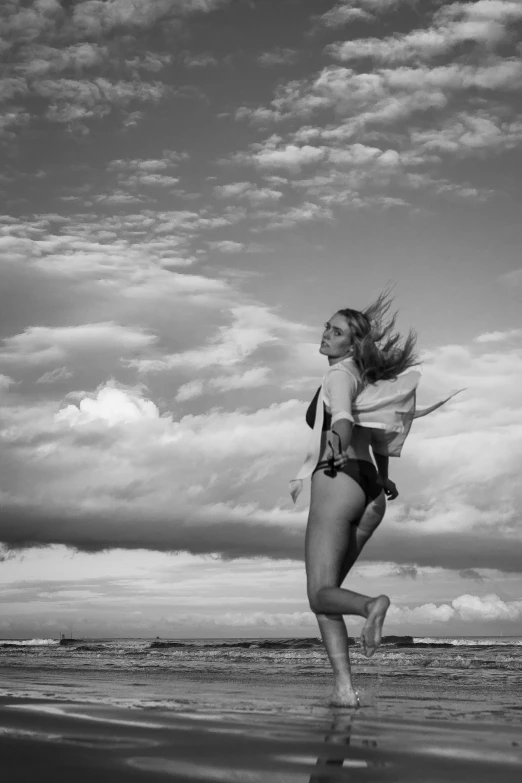 a woman is running on the beach