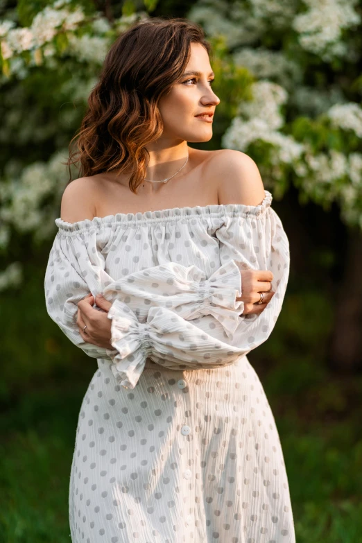 woman in white dress standing outside