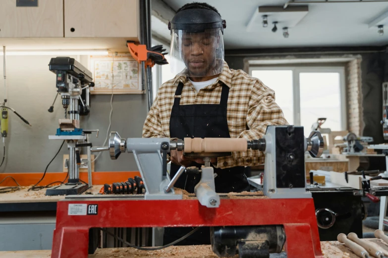 a person that is working in a room with tools