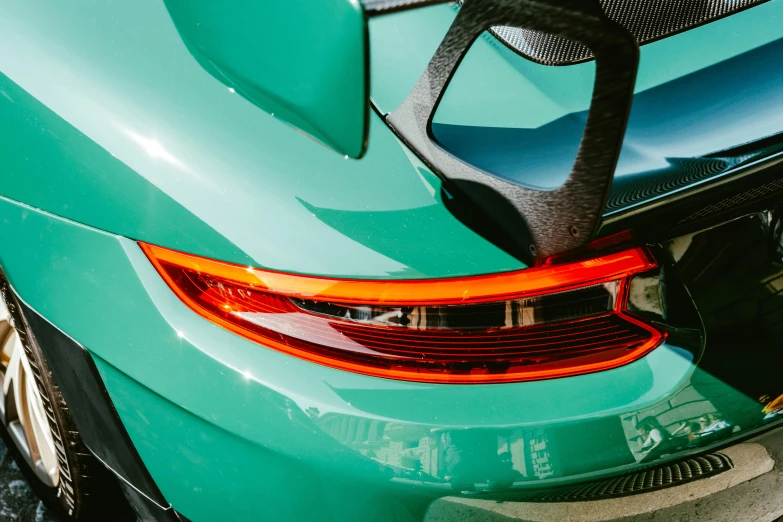 the tail light on a sports car in green