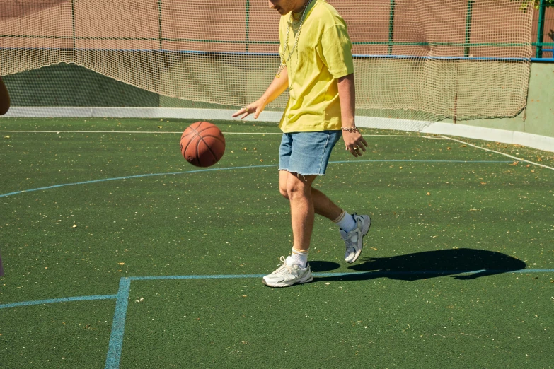 the young man is throwing a ball towards himself