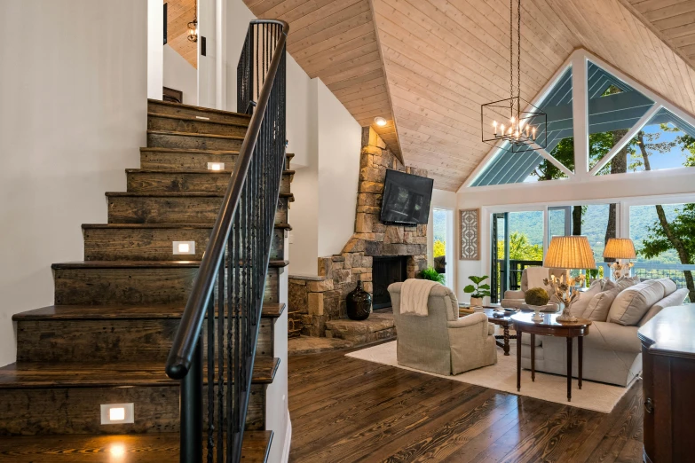 a wooden floor topped with lots of furniture and stairs