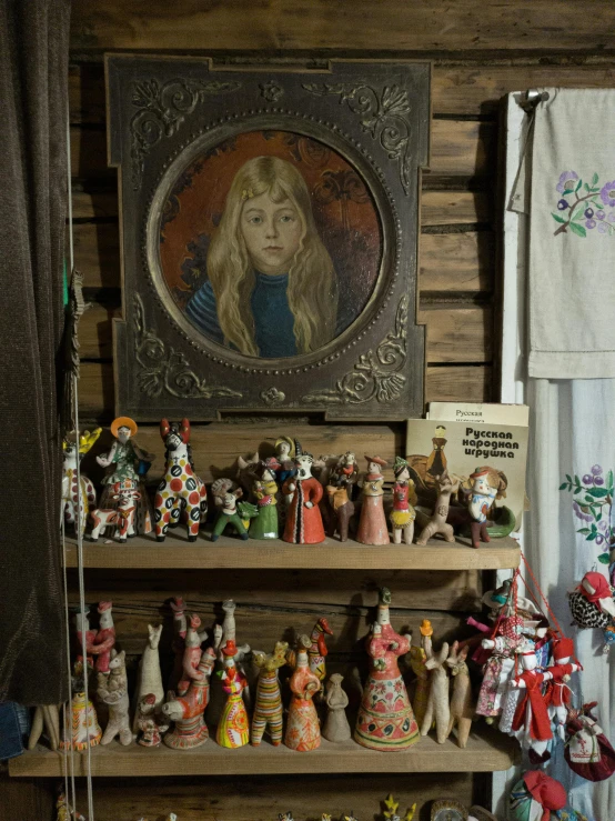 a picture and other miniature figurines on a shelf