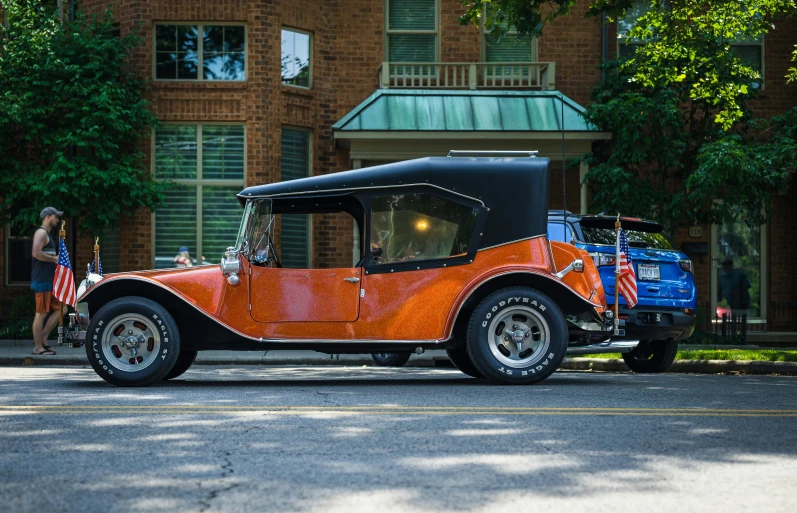 an old car is parked on the street