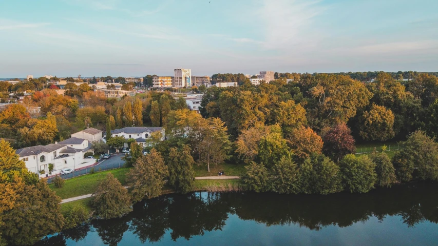 a river is shown next to some houses