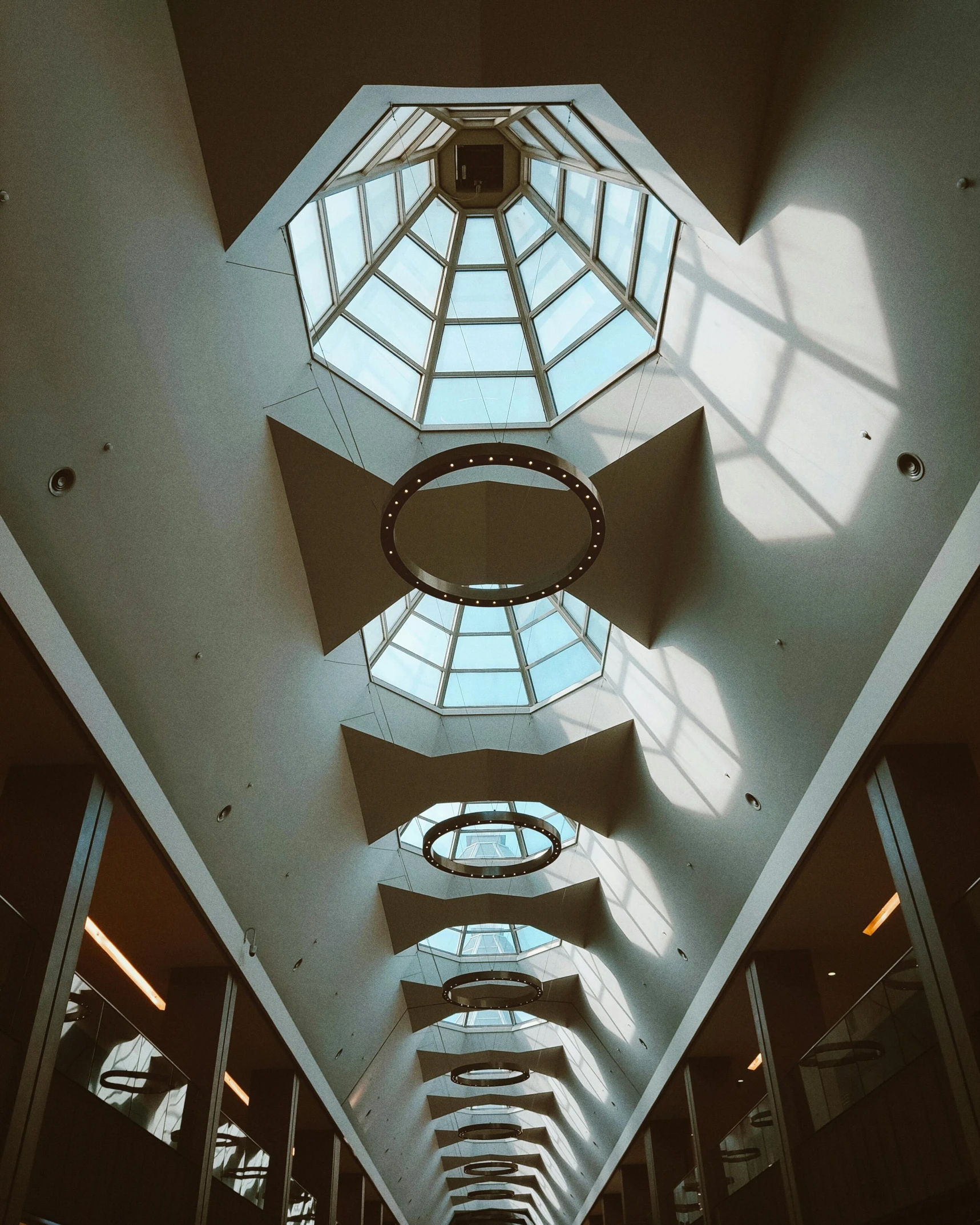 a long hallway that has been lined with glass windows