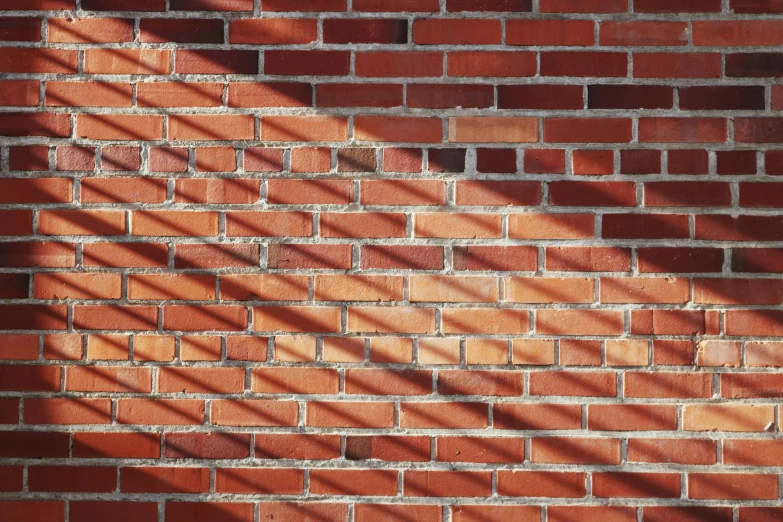 shadow cast on a brick wall and the corner is very tight