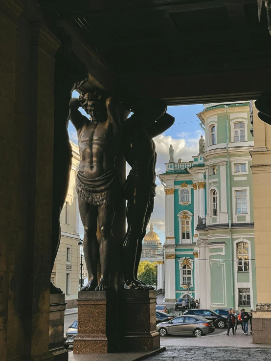 a statue of a man is in the center of the city