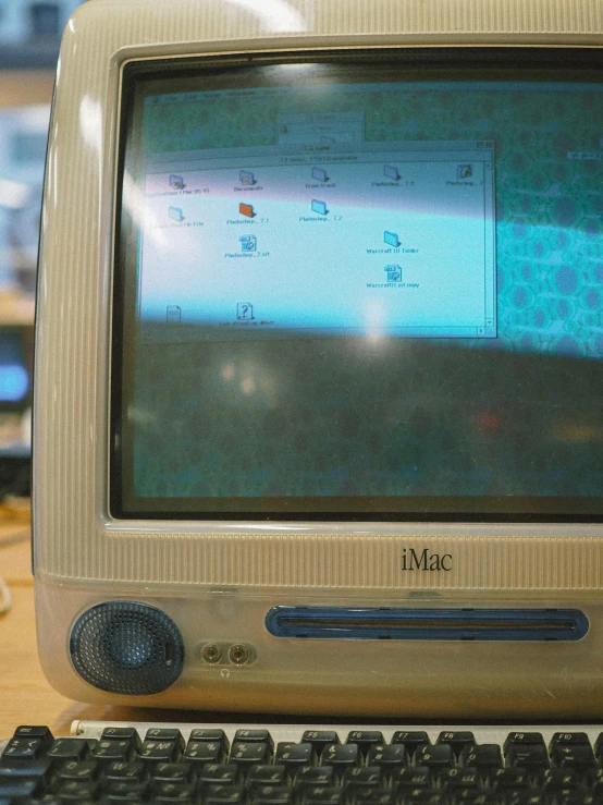 a computer screen is turned on and sitting on a desk