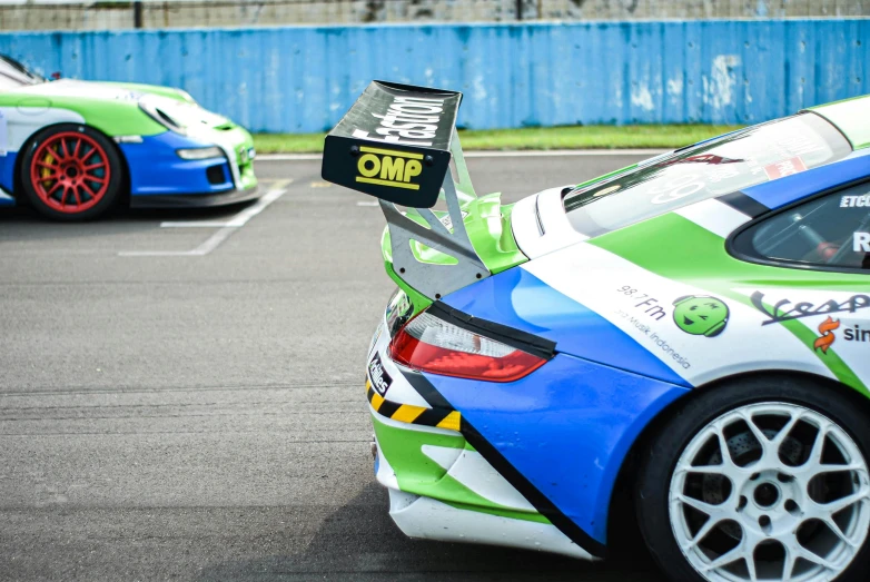 the front of a racing car on a race track