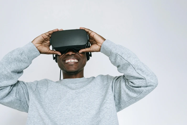 a man holding a device up to his head