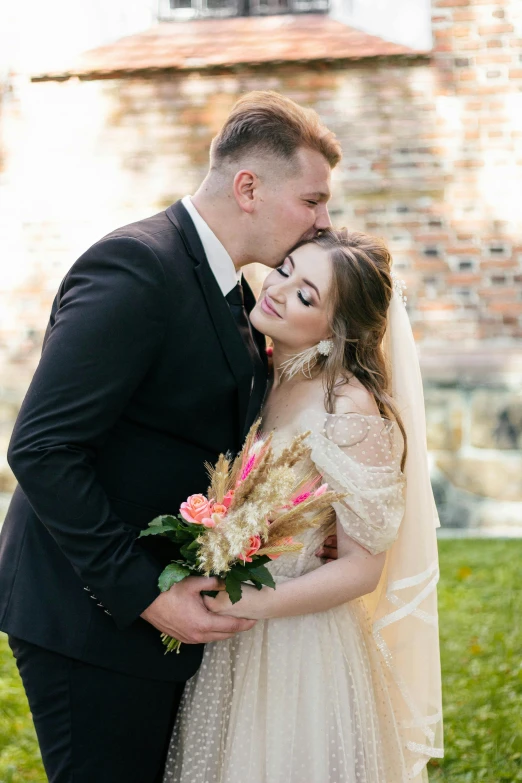 an image of two people dressed in wedding outfits