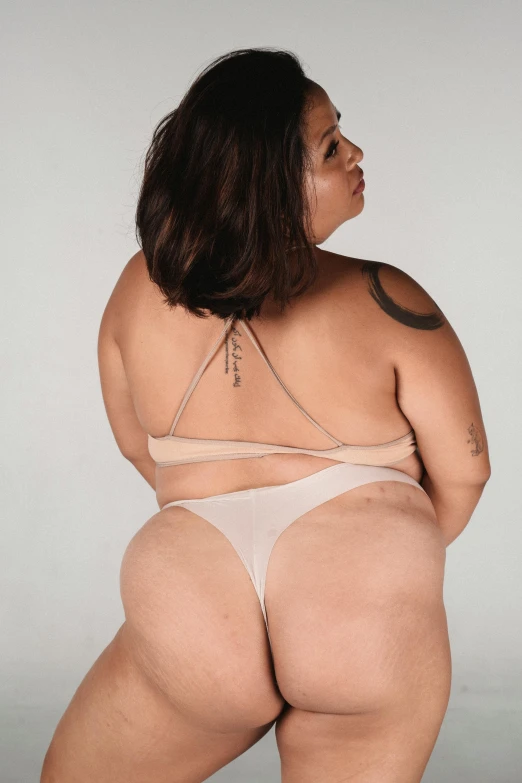 an overweight woman in her underwear