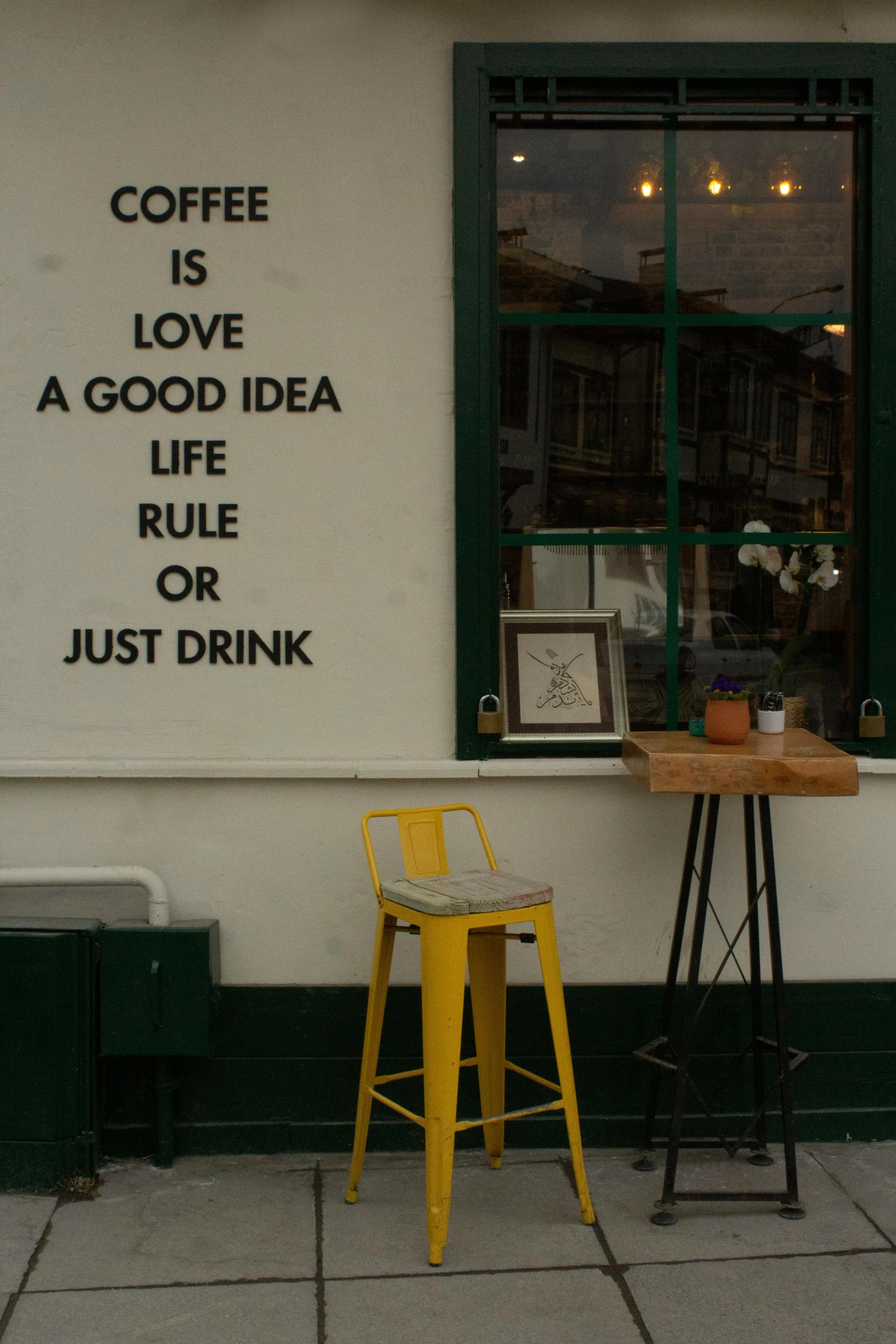 a chair sits in front of a window on a city street