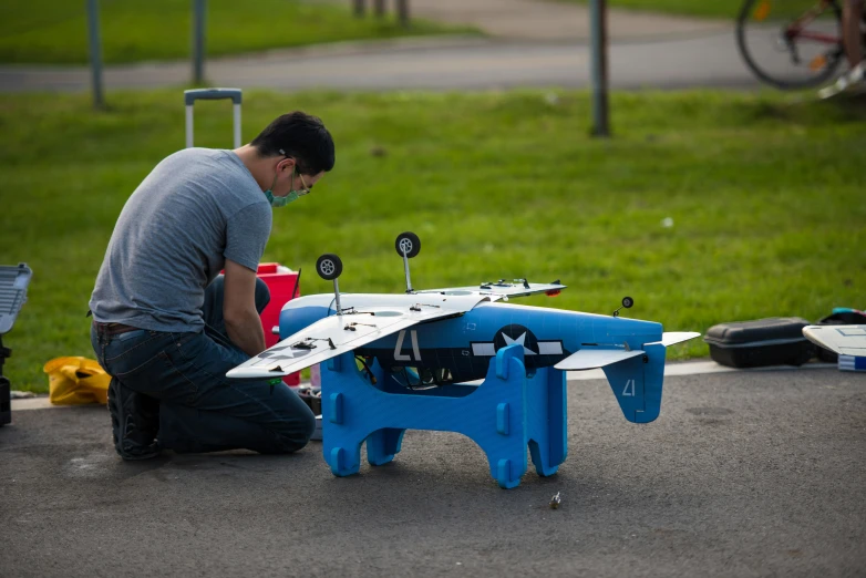 a person that is building a toy airplane