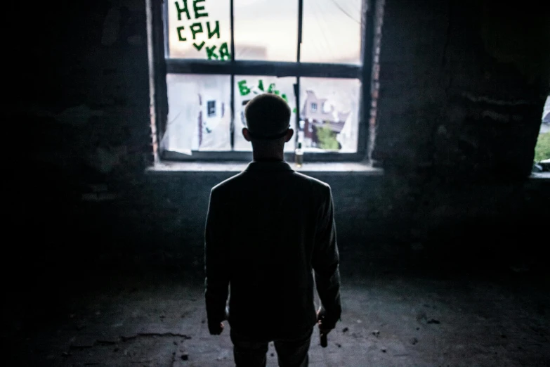 a person standing in front of a window