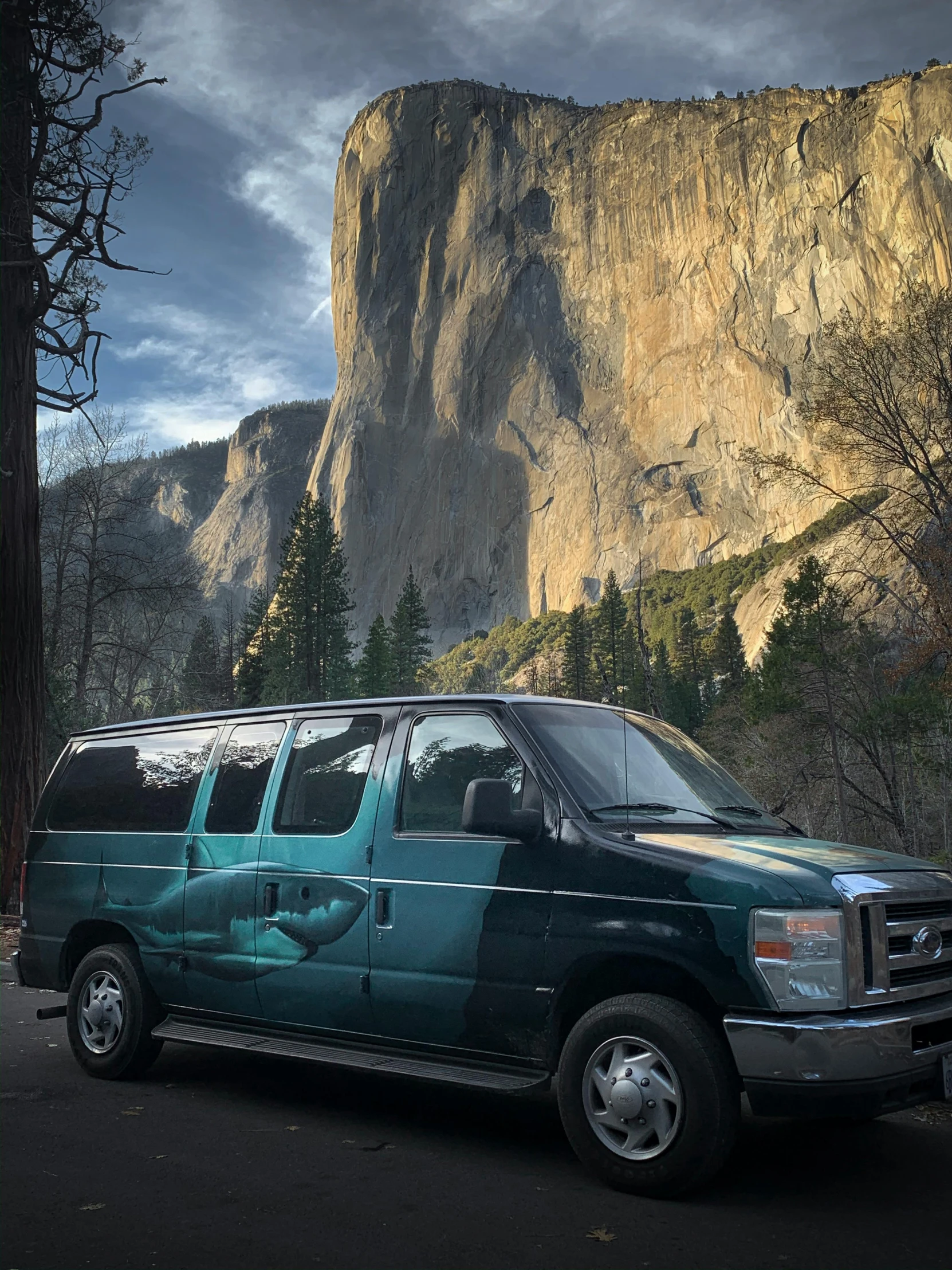 a very nice looking van parked by some pretty mountains