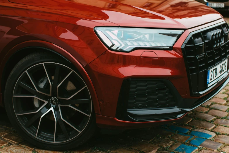 a red car with black rims is shown