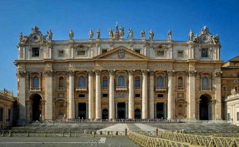 a large, ornate building with statues on top of it