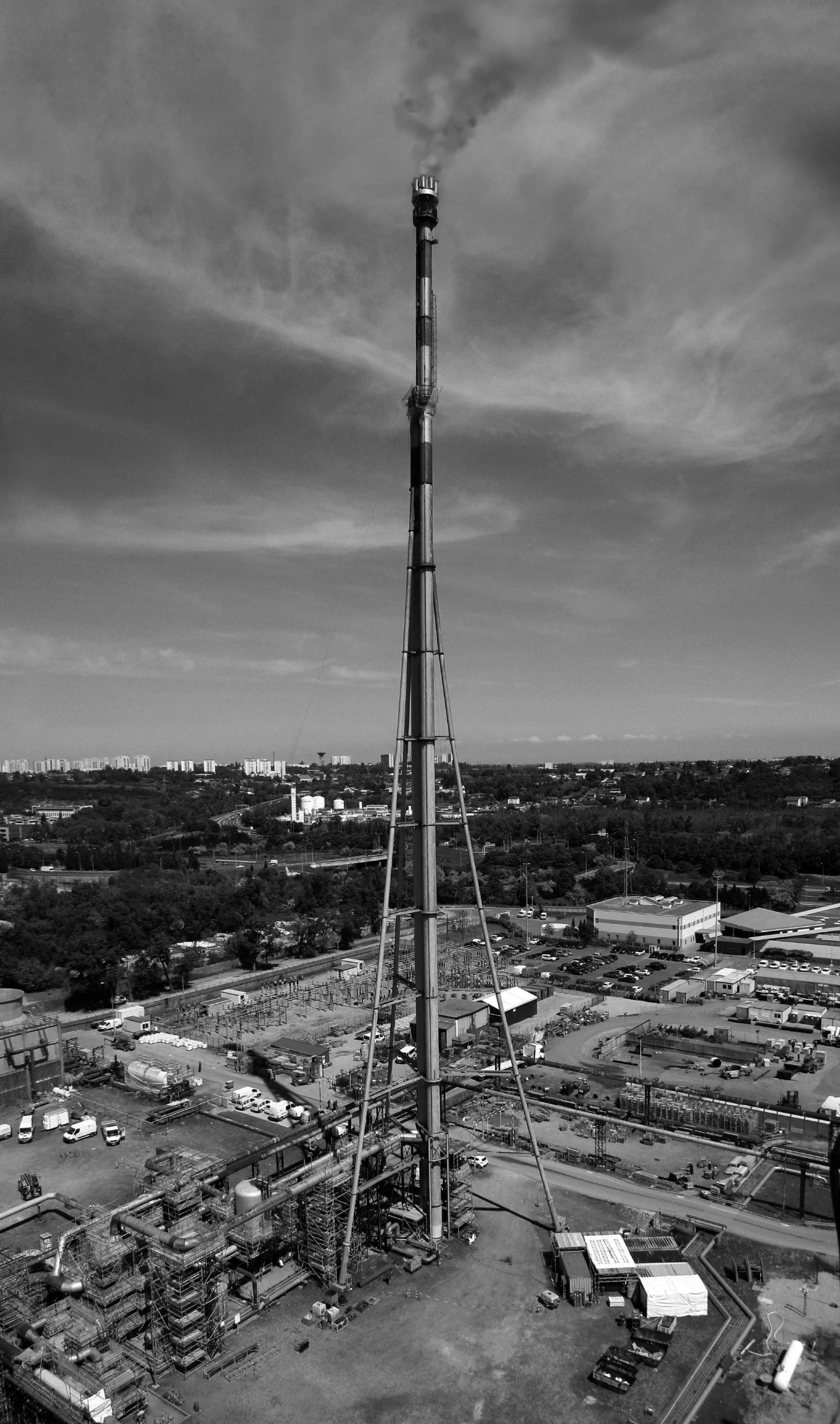 an image of an oil refinery and the sky