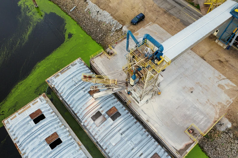 a large crane sits above a building under construction