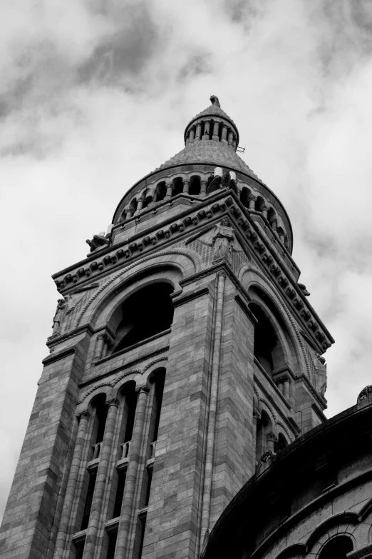 a black and white pograph of a large stone tower