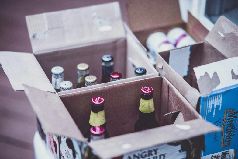 several boxes full of beer, beer and tea