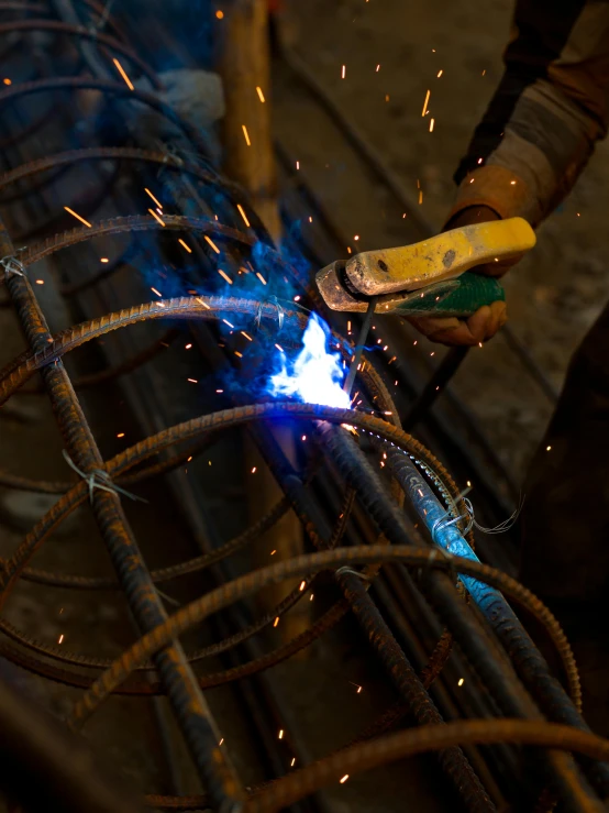 the welding worker is  the blue wire