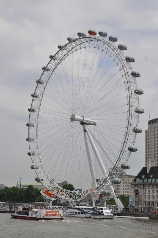 a big wheel with multiple sails on the water