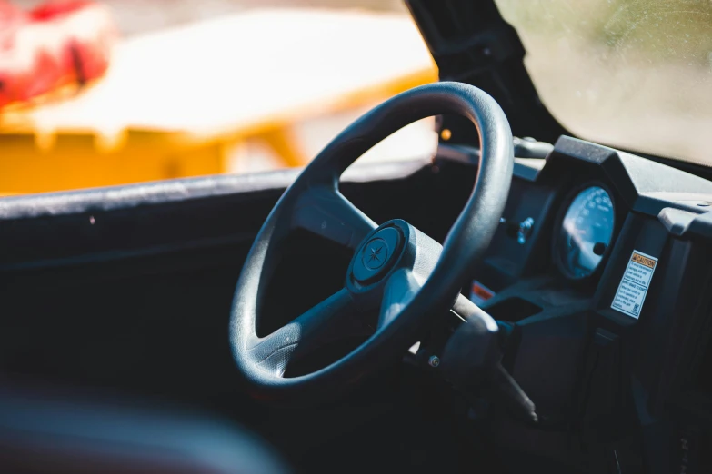 a close - up of the interior of a vehicle with it's steering wheel and instrument control ons