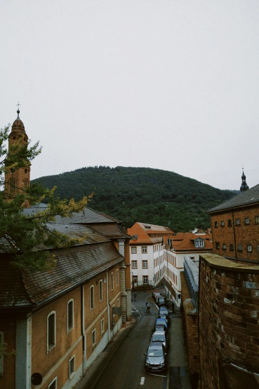 a city street with a clock tower in the back