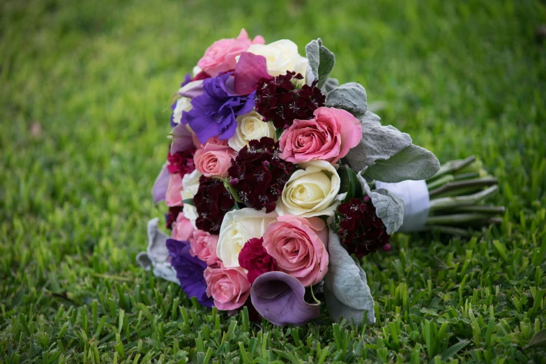 the bouquet on the grass is painted with flowers