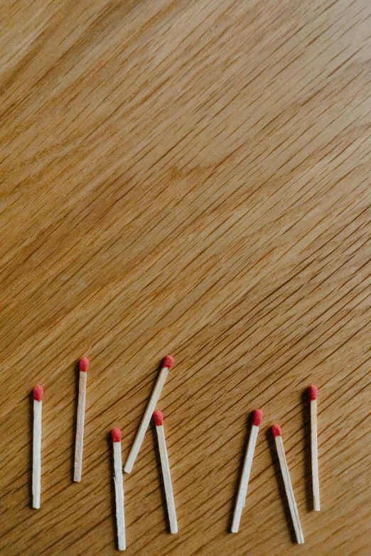 a group of cigarettes are on a table and broken ones