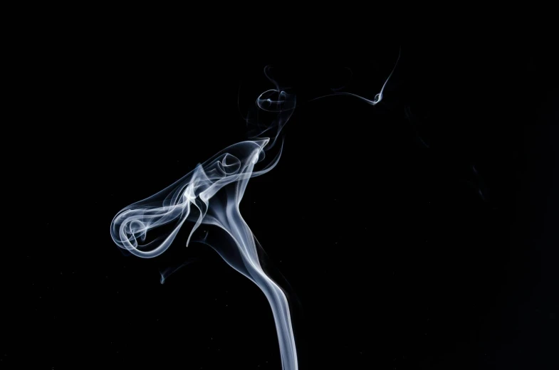 smoke is seen floating in the air in this image