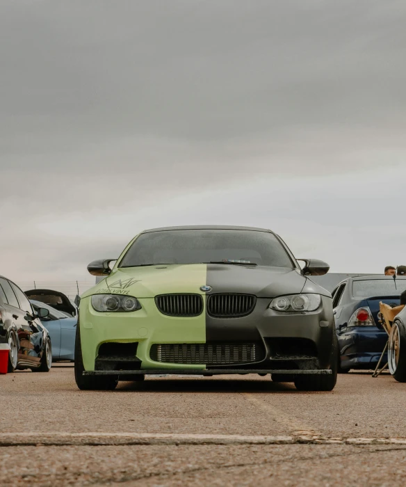 a close up of a car with the colors green and black