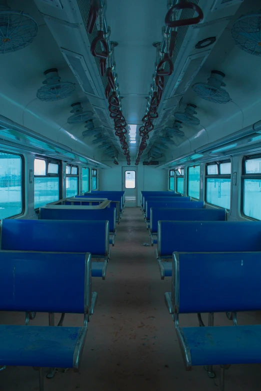 there are blue seats in the empty train