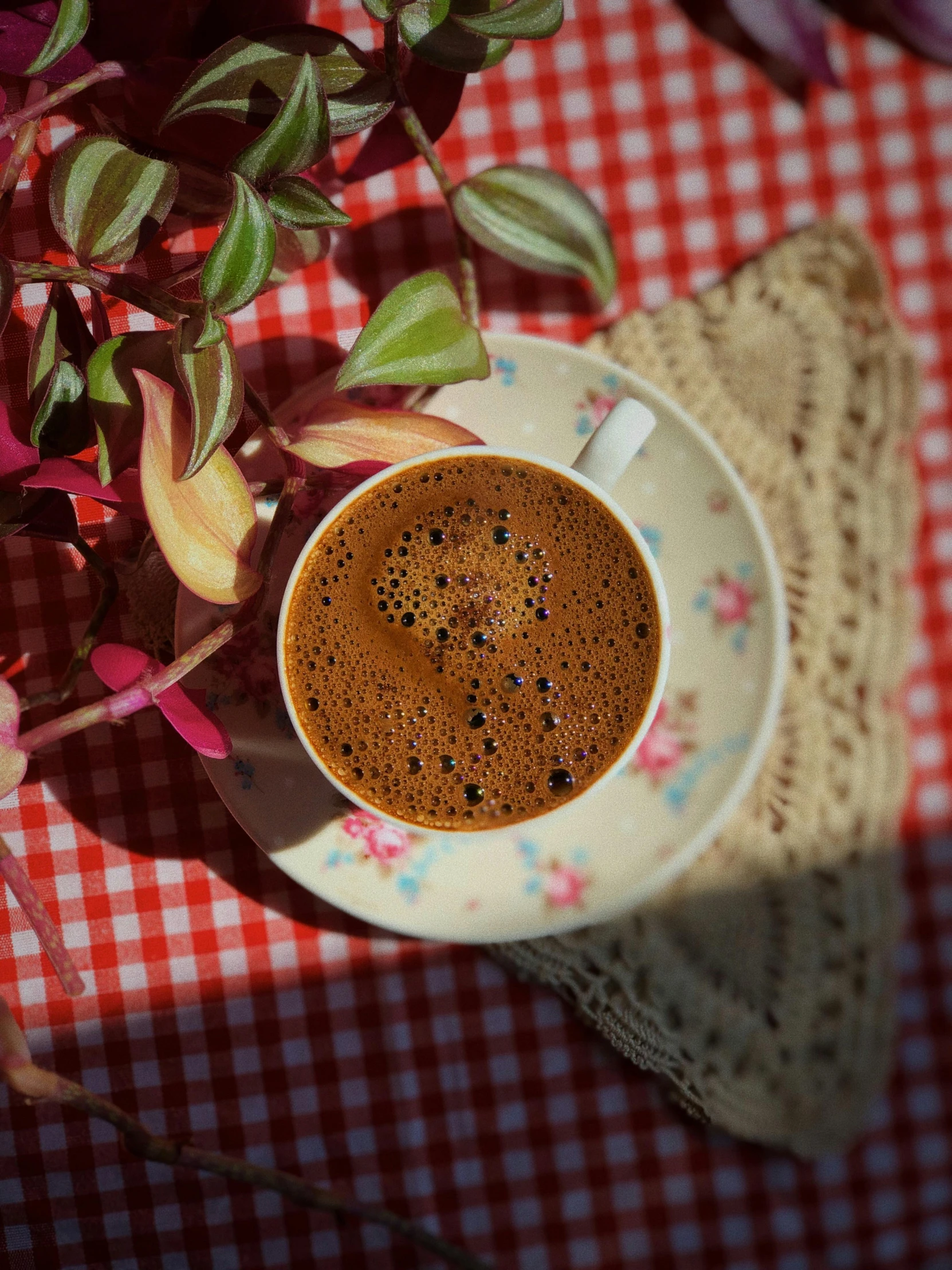 a cup of coffee sits on top of the table