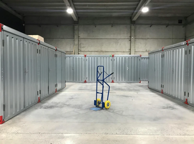 a portable toilet sits in a large storage room