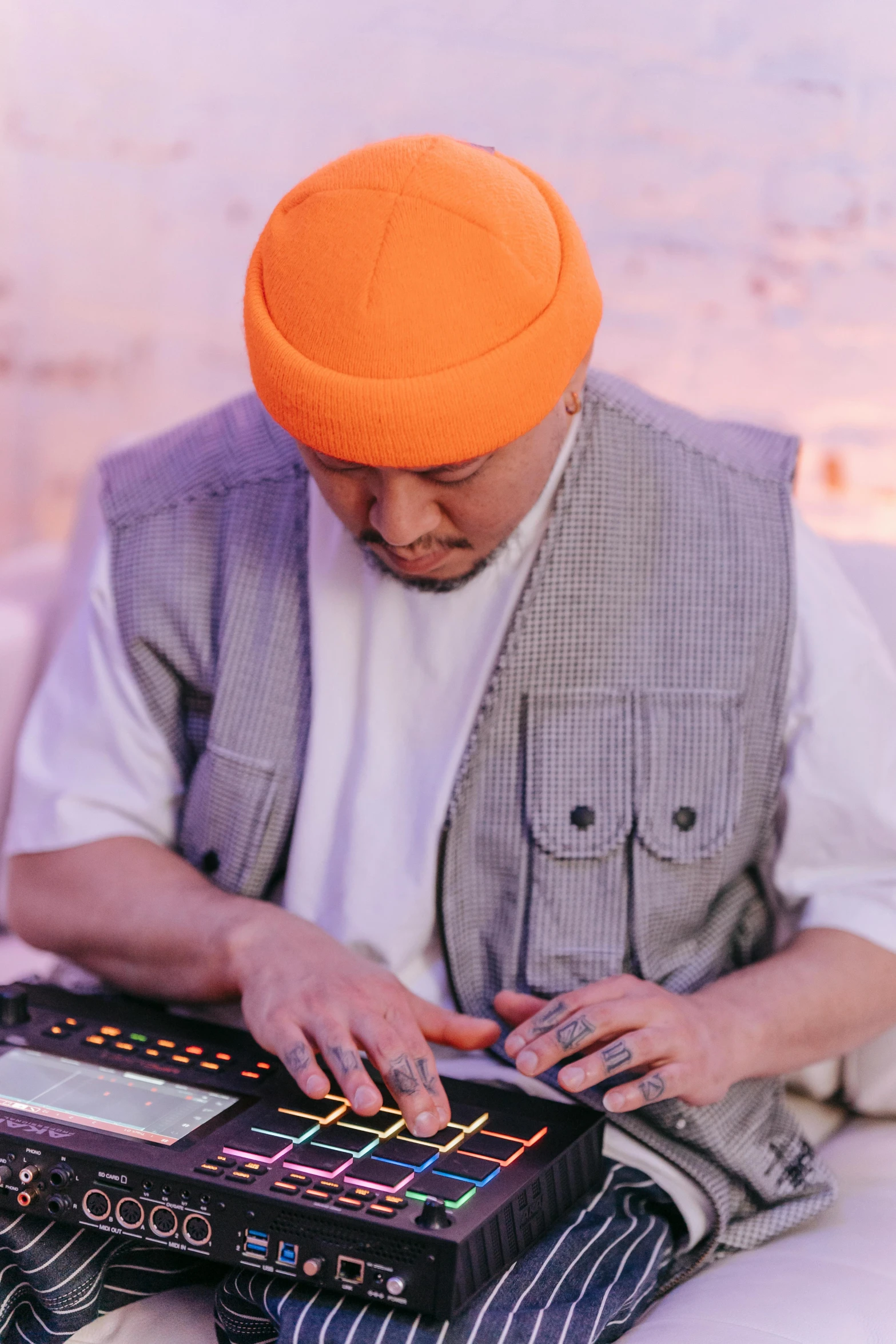 the man sits in a chair next to a large controller